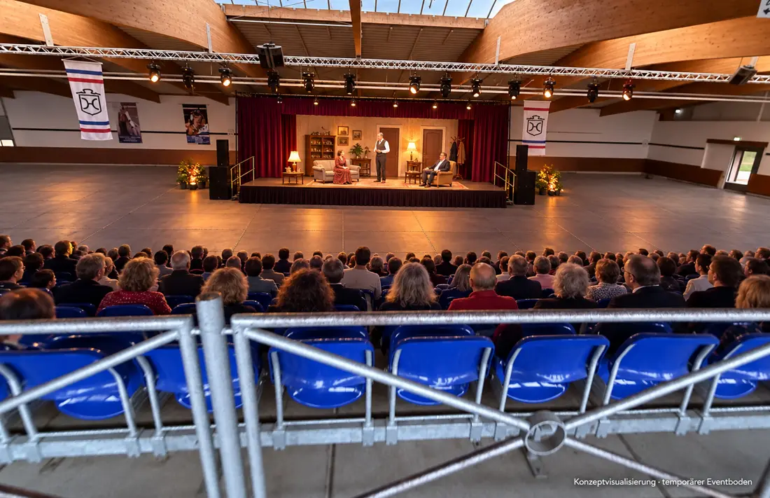 Konzeptvisualisierung: Theateraufführung auf einer Bühne in der Fritz-Thiedemann-Halle, Publikum auf der Tribüne